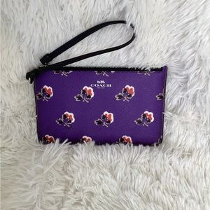 Coach bramble rose purple wristlet.  New condition